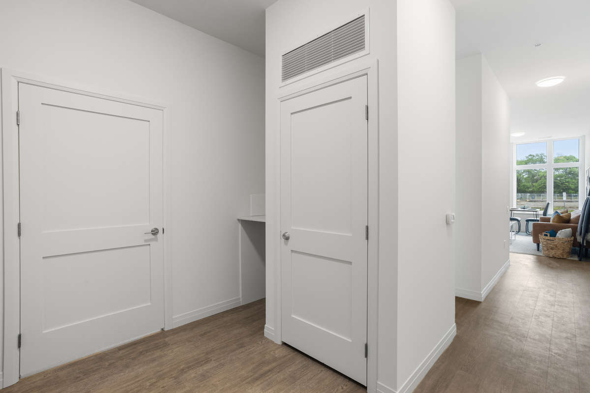 Hallway. Photo of a one-bedroom model suite apartment at Zerin Place on South Street at 370 South St. in London Ontario. A housing project by Zerin Development in VillageSoHo.