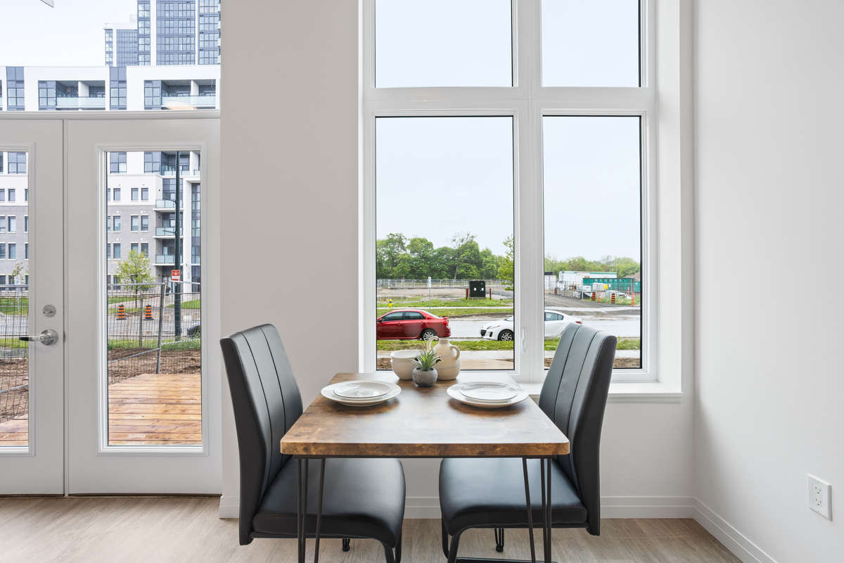 Modern open concept dining: Photo of a one-bedroom model suite apartment at Zerin Place on South Street at 370 South St. in London Ontario. A housing project by Zerin Development in VillageSoHo.